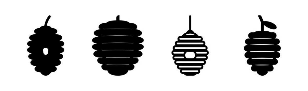 Four black silhouettes of bagworm moth larvae hanging down with varying shapes and textures