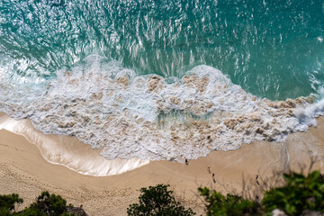 Aerial Top-Down View of a Beach with Gentle White Foamy Waves High quality photo