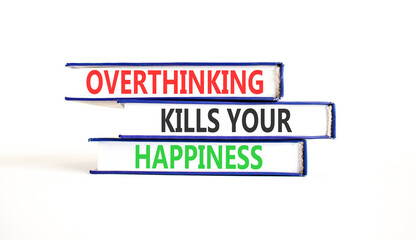 Fototapeta premium Overthinking kills your happiness symbol. Concept words Overthinking kills your happiness on books. Beautiful white paper background. Business overthinking kills happiness concept. Copy space.
