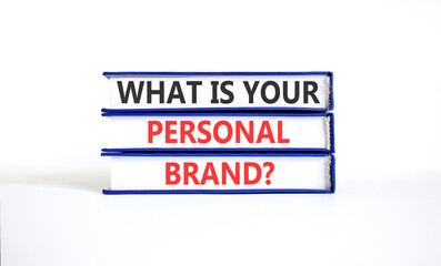 Fototapeta premium What is your personal brand symbol. Concept words What is your personal brand on beautiful books. Beautiful white paper background. Business what is your personal brand concept. Copy space.