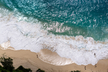 Aerial Top-Down View of a Beach with Gentle White Foamy Waves High quality photo