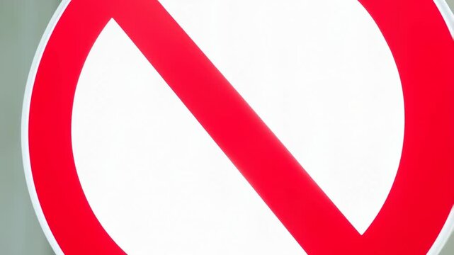 Closeup sequence of rotating no entry sign with dramatic perspective shift