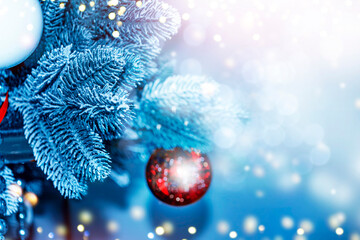 Greeting card. The New Year tree is decorated with festive ornaments and balls. Christmas background.