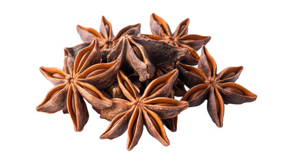 A bunch of star anise is spread out on a white background