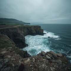 Dramatic Ocean Waves Crashing Against Rugged Cliffs on Overcast Day