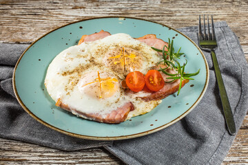 Fried eggs with pork ham.