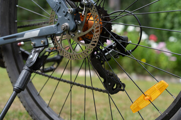 The brake disc on the bicycle wheel.Brake failure on a bicycle during a ride.