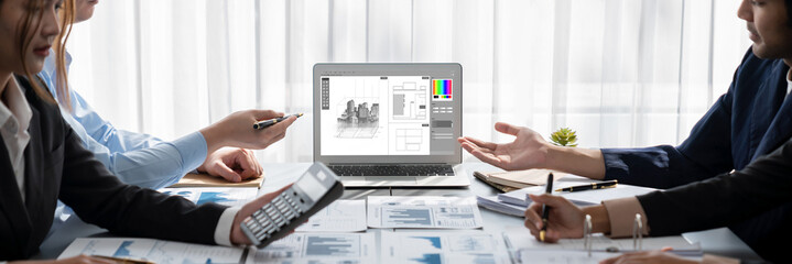 Business intelligence and data analysis concept. Analyst team working on financial data analysis dashboard on laptop screen as marketing indication for effective business strategic planning. Insight