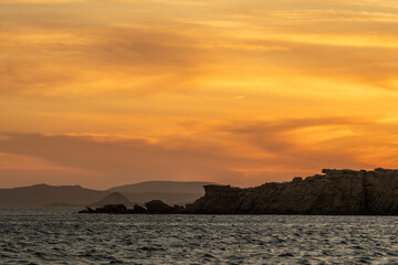 Golden Sunset Over the Aegean Sea and Rocky Coast, Greece