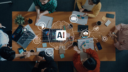 A diverse team engages in a collaborative meeting focused on artificial intelligence trends, discussing innovative ideas and strategies over a wooden table in a modern workspace. Trope
