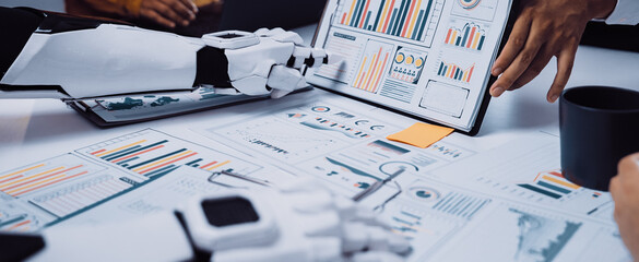 A unique interaction between human and robot in a professional setting, showcasing data analysis with various charts and graphs, emphasizing innovation in teamwork.Noogenesis