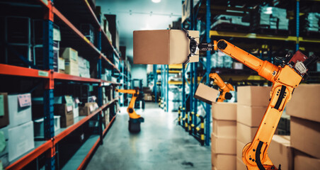 Naklejka premium Smart robot arm system for innovative warehouse and factory digital technology . Automation manufacturing robot controlled by industry engineering using IOT software connected to internet network .