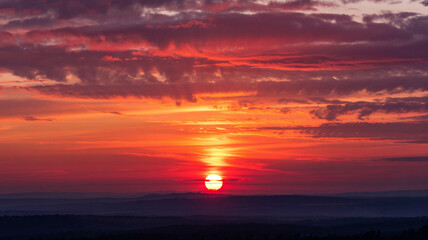 painting the sky with beautiful hues of red and gold