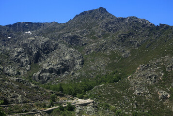 Obraz premium Panoramic view of The Serra da Estrela mountains and natural park in the Guarda district, Beiras Region, Portugal. Mainland Portugal's highest mountains at 1993 meters.