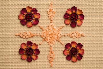 Aromatherapy Concept with Floral Elements and Pink Salt on Woven Texture