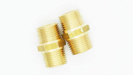 Two brass connectors placed on a white background for plumbing or mechanical purposes in a workshop setting