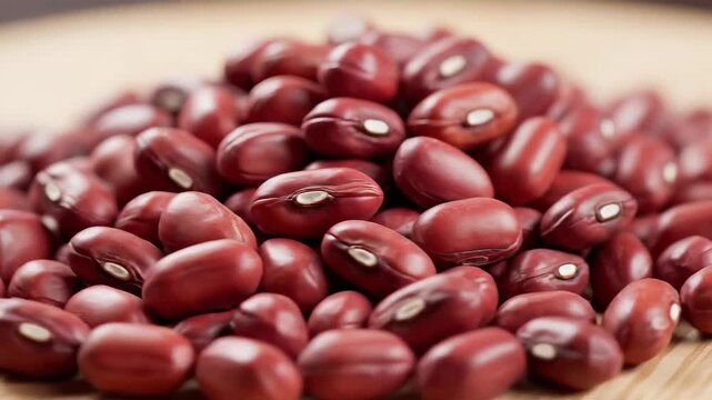 Closeup of a pile of red adzuki beans showcasing their rich color and texture perfect for cooking and healthy eating.