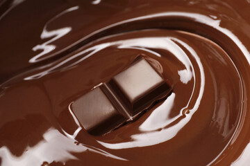Tasty melted chocolate and piece as background, closeup