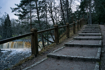 Fototapeta premium Riverside Stairway Above Waterfall in Keila-Joa, Estonia