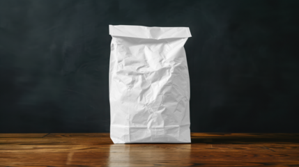 White paper bag  mockup on wooden table