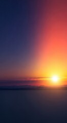 Obraz premium Wide panoramic landscape showing the atmospheric transition from deep twilight darkness to the vibrant colors of the rising morning sun, twilight, panorama, change