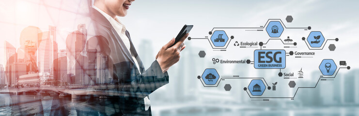 A business professional engages with a smartphone exploring ESG concepts within a modern urban setting, highlighting sustainability and governance in finance and industry. Tessel