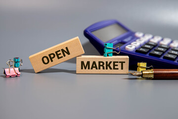 OPEN INTEREST text on a sticky on red notebook on the chart background.