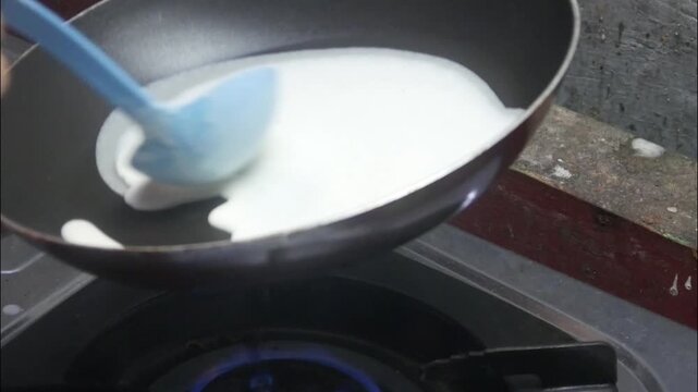 the process of making risol skin food in a Teflon pan made from wheat flour dough