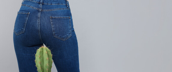 Woman and cactus on grey background, closeup. Plant with needles symbolizing painful symptoms of...