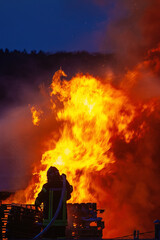 Team of firefighters extinguish large fire