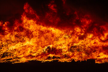 Big blaze and smoke at night