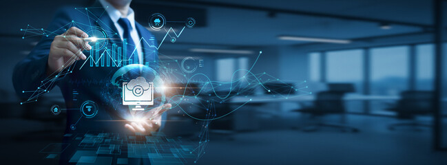 Businessman hand hold global Backup network and data, cloud storage protection, data recovery solutions, cybersecurity infrastructure, secure digital information management