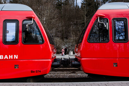 Zurich, Switzerland - December 21, 2024: A detailed photograph focusing on the coupling mechanism between two red SZU (Sihltal Z&uuml;rich Uetliberg Bahn) trains.