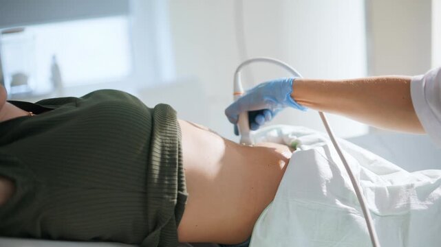 Pregnant woman having ultrasound examination closeup. Lady examining pregnancy