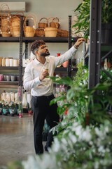 Man shopping for plants at flower shop
