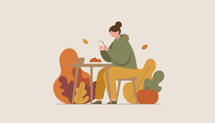 Fototapeta premium Woman uses smartphone at outdoor table enjoying coffee and leisure in a cozy autumn setting