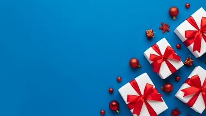 Obraz premium Festive Gift Boxes with Red Ribbons and Ornaments on a Blue Background