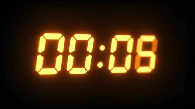 Glowing Digital Clock Displaying 00:17 in Dark Room