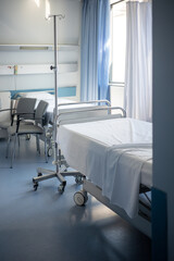 Healthcare facility accommodation with twin beds and seating for guests in a bright room with window light illustrating the standard of care and comfort provided in a private medical nursing home