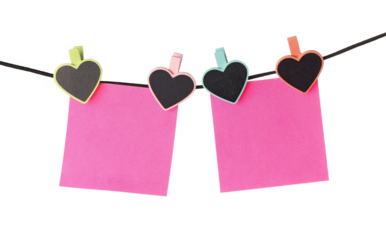 two pink notes hanging on a black string isolated on white background, valentines day heart shape clips for advertisement