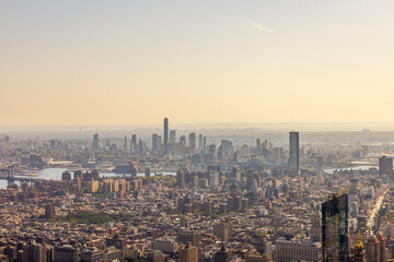 Fototapeta premium Beautiful view of New York City skyline with dense urban architecture stretching to horizon. USA.