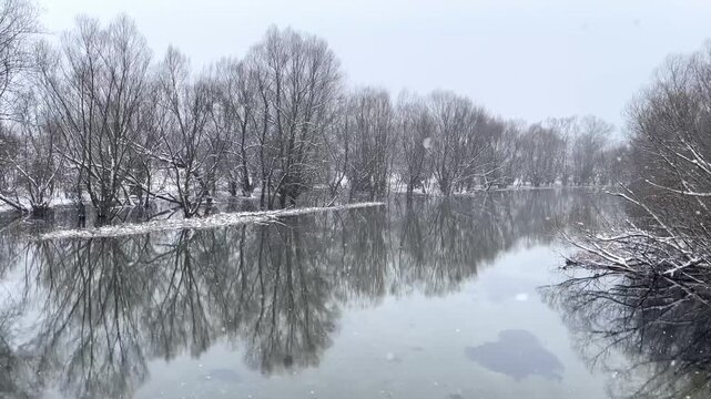 Aerial view of mountain lake at winter with snow. High quality 4k footage