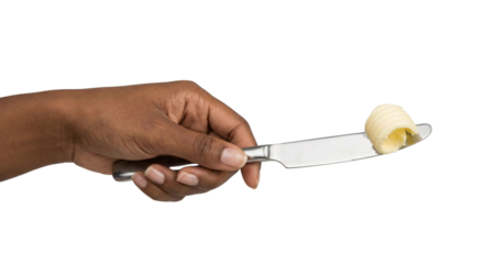 Hand holding butter on knife