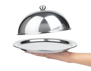 Close-up of a silver serving platter with the lid partially open, held in a hand