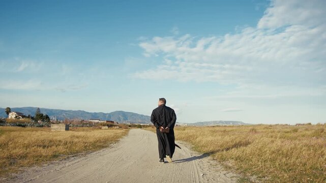 Monk With The Bible Following The Road Of God