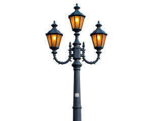 A triple-headed antique lamp post, black with three golden lights, isolated on black background