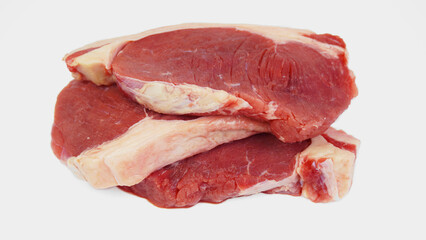 Fototapeta premium three piles of raw and fresh sirloin beef, raw, uncooked, isolated on white background