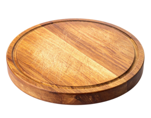 Close-up of a circular wooden cutting board, featuring wear and a juice groove
