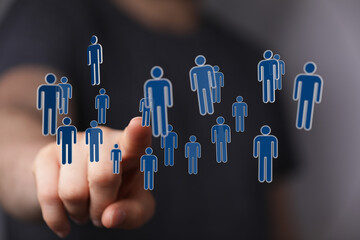 Hand interacts with a digital interface representing a social network or community. A concept of connection and