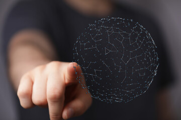 Close up of person's finger pointing at 3D network sphere, representing global connection, technology, internet and data, digital transformation